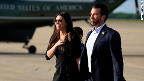 Donald Trump Jr., walks with Kimberly Guilfoyle after arriving at Andrews Air Force Base, Md., Wednesday, May 27, 2020, after traveling to Florida, with President Donald Trump. (AP Photo/Evan Vucci)